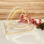 Transparent acrylic Heart Hamper Basket with gold outline – front view.