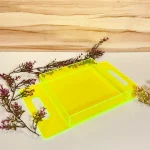 Neon green acrylic flat handle tray displayed with decor
