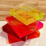 Stack of colorful acrylic jointless trays in multiple sizes.