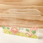 Acrylic floral horizontal bag placed on a wooden background.