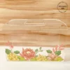 Transparent acrylic horizontal bag with multicolor lotus floral print, front view.