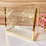 Printed Cross Bag placed on a table with decorative flowers beside it.