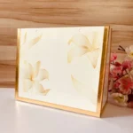 Angled shot highlighting floral detailing on Golden Cross Bag.