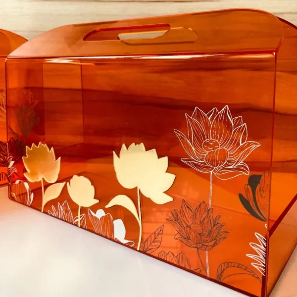 Side view of lotus-printed acrylic horizontal bag.