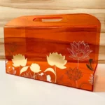 Horizontal acrylic bag with built-in handle, angled shot.