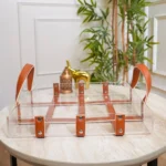 Minimalist serving tray with tan leather accents for home decor use.