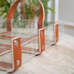 Modern rectangular acrylic tray styled with golden elephant and decor.