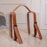 Decorative gifting box styled with paper filler and elegant lighting.