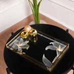 Close-up of gold Aurora Luxe Tray floral etching on mirrored base