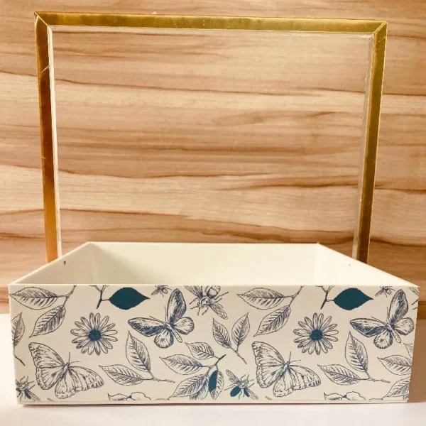 Close-up of gold metallic handle on tray.