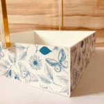 Side angle of butterfly design gold tray with handle.