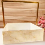Gold handle tray with floral gold print design.