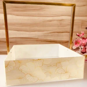 Gold handle tray with floral gold print design.