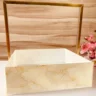 Gold handle tray with floral gold print design.