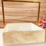 Decorative setup featuring gold handle tray for hampers.